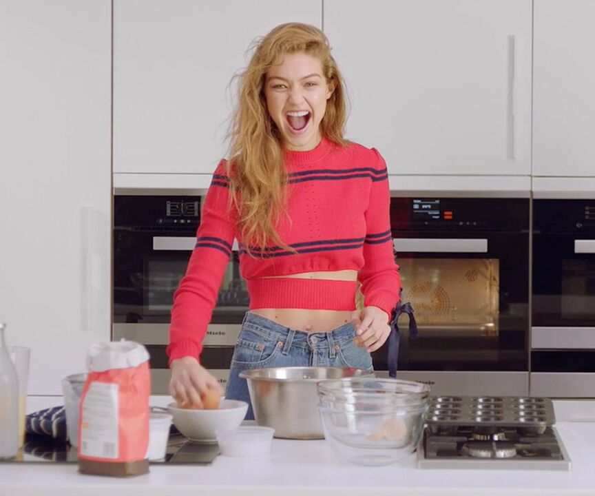 A slim girl cooks herself a healthy breakfast